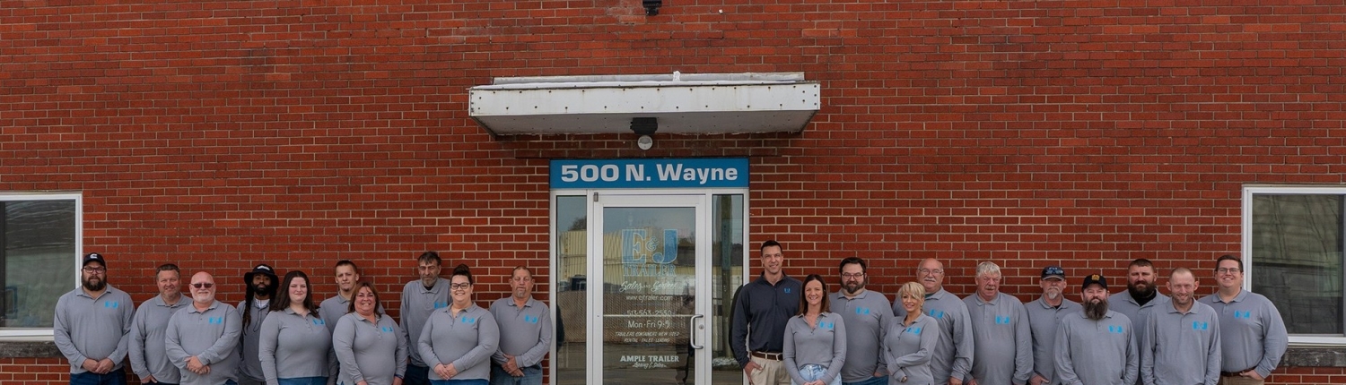 The E&J Container team standing together in front of the 500 N. Wayne Cincinnati office, representing our locally owned and family-operated staff.